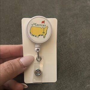 Masters White and Yellow Retractable Badge Reel with Red Flag Logo
